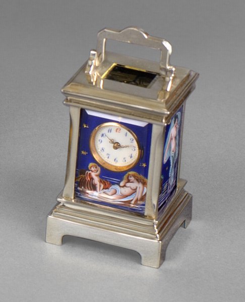 A miniature silver French carriage clock