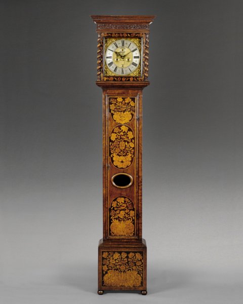 A well preserved William & Mary longcase clock in a walnut and marquetry veneered case